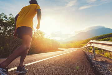 Wall Mural - Athlete runner feet running on road, Jogging concept at outdoors. Man running for exercise.