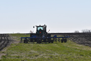 Canvas Print - Tractor in a Field