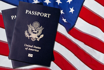 Wall Mural - US American Passports over an American flag background. 