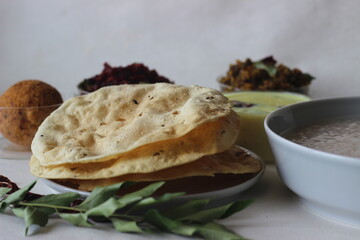 Wall Mural - Papadum made with seasoned dough of peeled black gram flour, either fried or cooked with dry heat flipped over an open flame