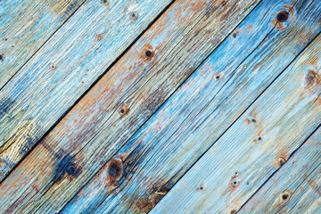 Texture of the planks of an old wooden table in antiqued pastel colors. Vintage rustic wooden background. Carpentry.