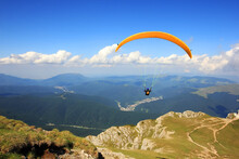 Paraglider Prepareing To Take Off From A Mountain