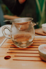 Woman serving Chinese tea in a tea ceremony.