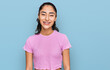 © Krakenimages.com - Hispanic teenager girl with dental braces wearing casual clothes with a happy and cool smile on face. lucky person.