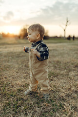 Child boy model posing in the nature 