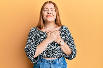 Sticker - Young beautiful redhead woman wearing shirt with floral print smiling with hands on chest, eyes closed with grateful gesture on face. health concept.