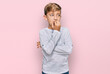 © Krakenimages.com - Little caucasian boy kid wearing casual clothes looking stressed and nervous with hands on mouth biting nails. anxiety problem.
