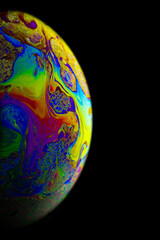 Wall Mural - Space galaxy planet. Globe earth in galaxy universe with abstract sun on black background. Color abstract fluorescent inks in water.