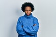 © Krakenimages.com - Young african american woman wearing casual clothes skeptic and nervous, disapproving expression on face with crossed arms. negative person.