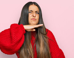 Canvas Print - Beautiful hispanic woman wearing casual clothes cutting throat with hand as knife, threaten aggression with furious violence