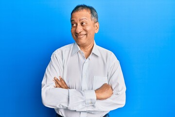 Poster - Middle age indian man with arms crossed gesture smiling looking to the side and staring away thinking.