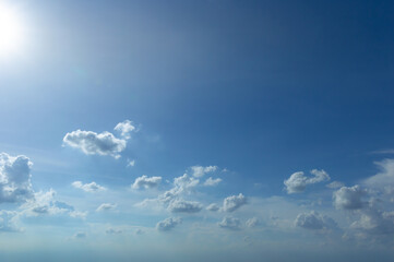 Wall Mural - blue sky background with tiny clouds. panorama white fluffy clouds in the blue sky.beautiful vast bl
