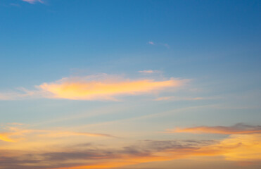 Wall Mural - beautiful sky painted by the sun leaving bright golden shades.dense clouds in twilight sky in winter