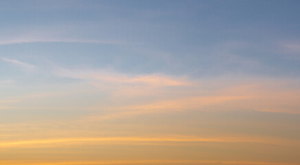 Wall Mural - beautiful vivid sky painted by the sun leaving bright golden shades.dense clouds in twilight sky in 
