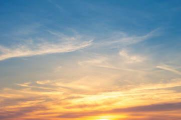 Wall Mural - beautiful vivid sky painted by the sun leaving bright golden shades.dense clouds in twilight sky in 