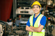 © Quality Stock Arts - confident Asian male engineer worker standing arm crossed happy smile for enjoy working in factory