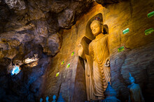 Large Stone Statue Of Buddha In A Cave In Wat Saket Golden Mountain Temple Famous Landmark In Bangkok, Thailand.