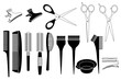 Ensemble d’objets noirs et blancs utilisés par les coiffeurs - peignes, brosses, ciseaux, pinces à cheveux.