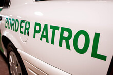 Customs And Border Patrol Logo On The Side Of The Patrol Car