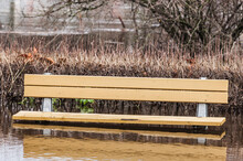 Flooded Bench In Park, Sweden.