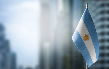 Wall Mural - A small flag of Argentina on the background of a blurred background