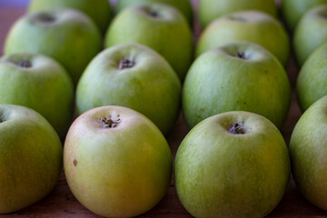 Wall Mural - Apples stand on a wooden surface