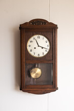Antique Clock On A Wooden Wall