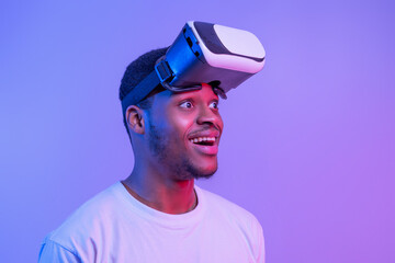 Wall Mural - Video Gaming Concept. Portrait Of Amazed Funny Black Man Wearing VR Glasses