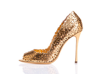 Wall Mural - Beautiful womens high-heeled shoes. Evening party shoes. Gold shoes with heels.