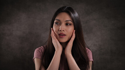 Wall Mural - Studio portrait of a pretty Asian girl - studio photography