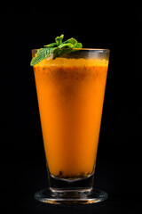 Poster - Sea buckthorn and sea buckthorn juice in glass isolated on black background.