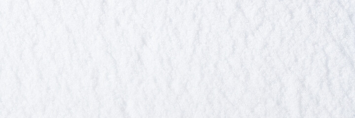 Wall Mural - Natural snow texture. Smooth surface of clean fresh snow. Snowy ground. Winter background with snow patterns. Perfect for Christmas and New Year design. Closeup top view.