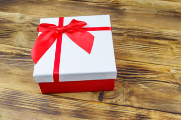 Gift box on a wooden background