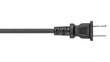 © artiom.photo - Electrical Wire with Power plug. Black rubber Cord or cable with plug. United States and Canada, national standards voltage 110V - 120V. Macro close-up photo on white isolated background.