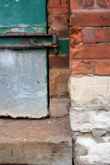 Wall Mural - Peeling Green Window in Red and White Brick Wall with Rusty Hinges in Toronto Canada 