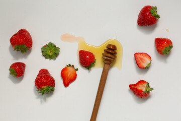 Wall Mural - Strawberry and honey isolated on white background