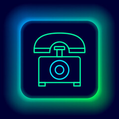 Wall Mural - Glowing neon line Telephone icon isolated on black background. Landline phone. Colorful outline concept. Vector