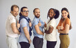 © Studio Romantic - Studio group portrait of happy healthy responsible multiethnic male and female citizens giving thumbs-up after receiving vaccine. Diverse people promoting vaccination during World Immunization Week