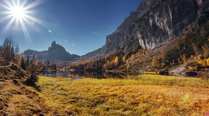 Fotobehang - Fantastic Sunny morning over the mountain valley in Dolomites alps. Scenic image of Autumn scenery in mountains. Federa lake. Italy. popular touristic place. Best famouse travel locations.