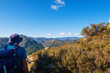 © MiguelAngel - Hikers walking on mountains, in a sunny spring day. In La vall de laguar, Alicante (Spain)