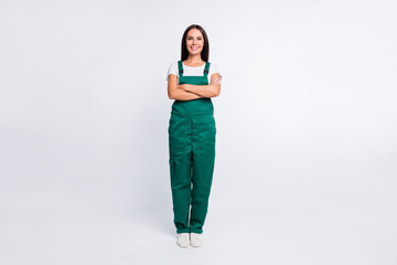 Poster - Full body photo of young woman happy positive smile crossed hands wear uniform courier delivery isolated over white color background