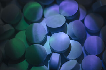 Fototapete - Pills or drugs in a package under neon light. Beautiful background pattern for design.