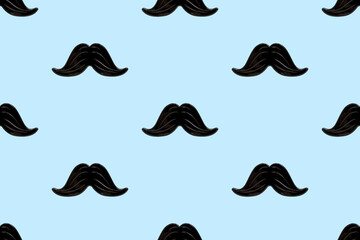 Black mustache seamless pattern on a blue background. Happy father's day and masculinity concept. Retro stylish design for wrapping paper, fabrics, man textiles, clothes for a boy