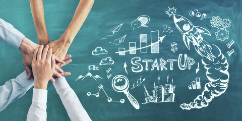 Aufkleber - Business idea concept with human hands and handwritten sketch of startup icons on green chalkboard background.