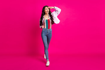 Poster - Full size photo of impressed brunette nice lady go look wear top jacket jeans sneakers isolated on pink color background