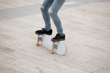 Wall Mural - Skateboarder legs skateboarding at outdoors