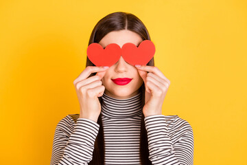 Poster - Photo of nice pretty young woman cover eyes small heart figures isolated on shine yellow color background