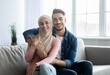 © Prostock-studio - Loving arab couple sitting on couch at home, embracing