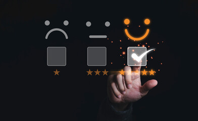 Poster - Businessman touching and doing mark to select smiley face with five yellow stars on black background, the best customer satisfaction and evaluation for good quality product and service.