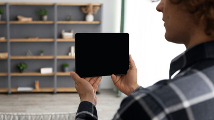 Poster - Man Holding Tablet With Empty Screen Standing At Home, Mockup